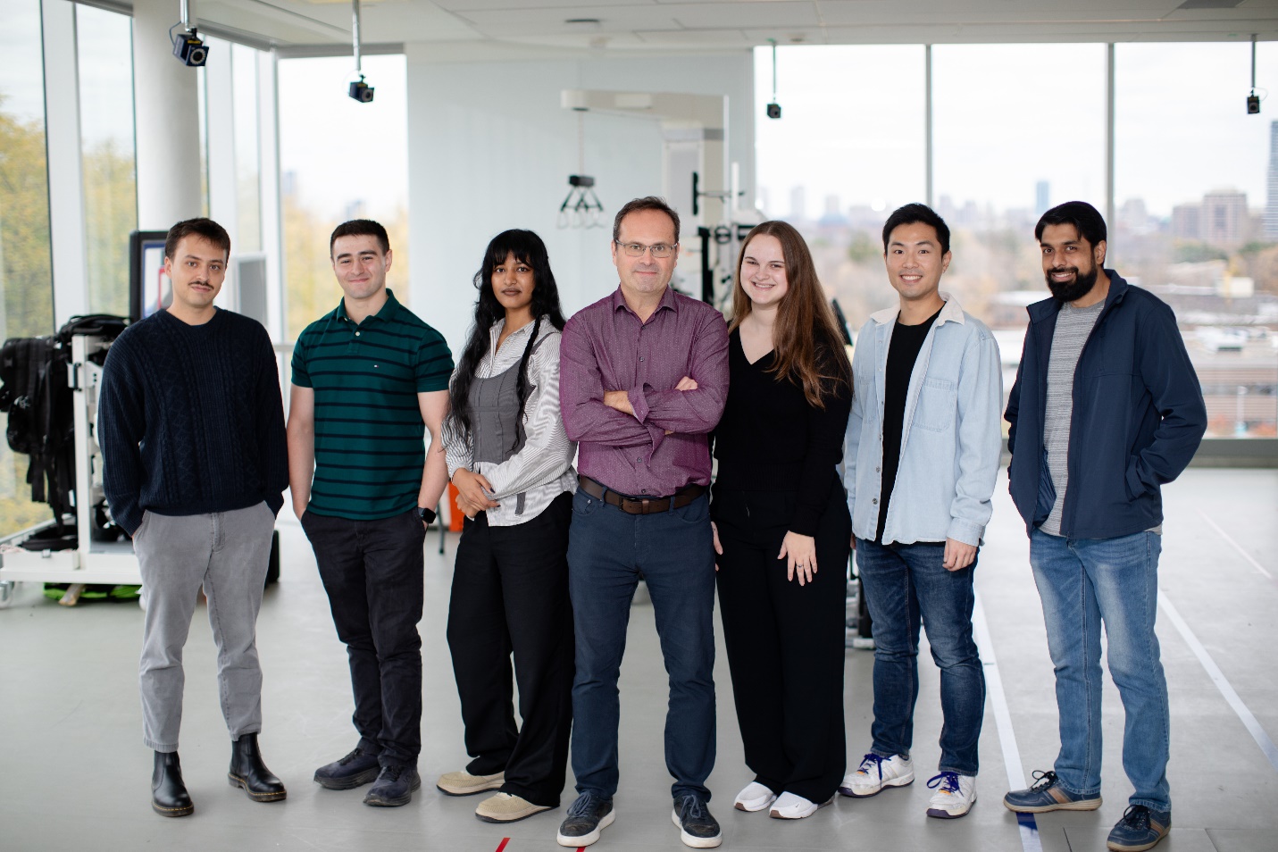 A group of people standing together

AI-generated content may be incorrect.